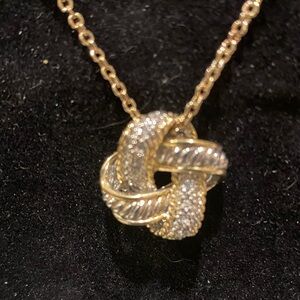 Elegant Gold and Silver Knot Pendant Necklace